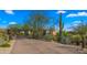 Charming home with desert landscaping including mature cacti and native trees at 30600 N Pima Rd # 61, Scottsdale, AZ 85266
