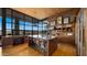 Gourmet kitchen featuring wood cabinets, granite countertops, an island with seating, and beautiful desert views at 30600 N Pima Rd # 61, Scottsdale, AZ 85266
