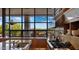 Kitchen with stainless steel appliances, granite countertops, and large windows with views of the outdoor living space at 30600 N Pima Rd # 61, Scottsdale, AZ 85266
