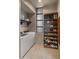 Laundry room featuring a washer, dryer, storage shelving, and natural light at 30600 N Pima Rd # 61, Scottsdale, AZ 85266
