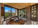 Bright living room with a comfortable sofa, colorful rug, and scenic outdoor views at 30600 N Pima Rd # 61, Scottsdale, AZ 85266