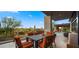 Outdoor dining next to desert landscape and pool at 30600 N Pima Rd # 61, Scottsdale, AZ 85266