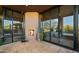 Outdoor fireplace with access to indoor bedroom and living room at 30600 N Pima Rd # 61, Scottsdale, AZ 85266