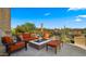 Cozy outdoor living space with comfortable seating, a fire pit, and desert views for entertaining at 30600 N Pima Rd # 61, Scottsdale, AZ 85266