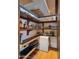 Walk-in pantry with wood shelving, tile flooring, and plenty of storage space for food and supplies at 30600 N Pima Rd # 61, Scottsdale, AZ 85266
