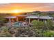 Desert home with a private pool and fire features in a desert landscape at 30600 N Pima Rd # 61, Scottsdale, AZ 85266