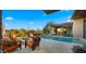Inviting pool area with a fire pit, desert landscaping, and comfortable seating for relaxation at 30600 N Pima Rd # 61, Scottsdale, AZ 85266