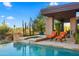 A private pool and spa area with desert views, a fire pit, and poolside lounge chairs at 30600 N Pima Rd # 61, Scottsdale, AZ 85266