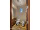 Cozy powder room featuring stone floors, a modern toilet, and unique bidet at 30600 N Pima Rd # 61, Scottsdale, AZ 85266
