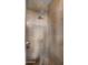Close-up of a luxurious walk-in shower with grey tiling and modern fixtures at 30600 N Pima Rd # 61, Scottsdale, AZ 85266