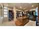 Spacious walk-in closet featuring a center island, custom shelving, and laundry unit at 30600 N Pima Rd # 61, Scottsdale, AZ 85266