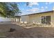 Expansive backyard with mature trees and a low-maintenance landscape at 3218 W Clinton St, Phoenix, AZ 85029