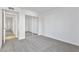 An airy bedroom features light-colored carpet, a closet with mirrored doors, and a neutral wall color at 3218 W Clinton St, Phoenix, AZ 85029