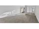 Bedroom showcasing carpet, mirrored closet, and a sliding glass door with natural light at 3218 W Clinton St, Phoenix, AZ 85029