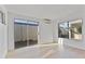 Bright room featuring light wood floors, neutral paint, and multiple windows for natural light at 3218 W Clinton St, Phoenix, AZ 85029