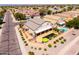 Aerial shot showcasing a property with a pool, outdoor dining, and manicured landscaping in a suburban neighborhood at 3597 W Mineral Butte Dr, San Tan Valley, AZ 85144