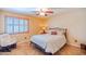 Bedroom with shuttered window, neutral color palette and comfortable furnishings at 3597 W Mineral Butte Dr, San Tan Valley, AZ 85144