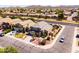 An aerial view of a home featuring desert landscaping, complemented by a neighborhood of similar homes at 3597 W Mineral Butte Dr, San Tan Valley, AZ 85144