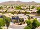 A charming two-story home with a well-manicured lawn and desert landscaping, complimented by the neighborhood view at 3597 W Mineral Butte Dr, San Tan Valley, AZ 85144