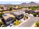 A charming two-story home with a well-manicured lawn, complemented by desert landscaping and neighborhood view at 3597 W Mineral Butte Dr, San Tan Valley, AZ 85144