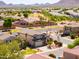 An aerial view of a two-story home with desert landscaping and neighborhood view at 3597 W Mineral Butte Dr, San Tan Valley, AZ 85144
