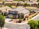 An aerial view of a home featuring desert landscaping and neighborhood with mature trees at 3597 W Mineral Butte Dr, San Tan Valley, AZ 85144