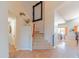Bright foyer features travertine tile flooring, staircase, and views of dining and kitchen at 3597 W Mineral Butte Dr, San Tan Valley, AZ 85144