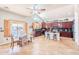 Eat-in kitchen with dark wood cabinets, island seating, and expansive backyard views at 3597 W Mineral Butte Dr, San Tan Valley, AZ 85144
