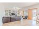 Bright, open living room with custom built-ins and sliding glass door to the patio at 3597 W Mineral Butte Dr, San Tan Valley, AZ 85144