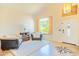 Inviting living area with cozy seating, vaulted ceiling, and large window offering ample natural light at 3597 W Mineral Butte Dr, San Tan Valley, AZ 85144