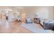 Spacious open-concept living area featuring a plush rug, comfortable seating, and neutral décor for relaxation and gatherings at 3597 W Mineral Butte Dr, San Tan Valley, AZ 85144