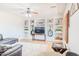 Comfortable living room with recessed display shelving and a modern ceiling fan for added comfort at 3597 W Mineral Butte Dr, San Tan Valley, AZ 85144