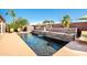 Beautiful backyard with a sparkling pool, water feature, lounge chairs, and lush landscaping at 3597 W Mineral Butte Dr, San Tan Valley, AZ 85144