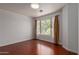 Bright bedroom features hardwood floors, large windows offering natural light and treetop views at 3821 W Barcelona Dr, Chandler, AZ 85226