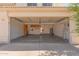 Spacious garage with ample storage cabinets, shelving, and a workbench area at 3821 W Barcelona Dr, Chandler, AZ 85226