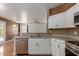 Open concept kitchen with stainless steel dishwasher and breakfast bar at 3821 W Barcelona Dr, Chandler, AZ 85226