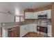 Kitchen area with stainless steel appliances and tile backsplash at 3821 W Barcelona Dr, Chandler, AZ 85226