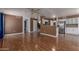 Bright living area boasting an open layout, hardwood floors, and adjacent kitchen at 3821 W Barcelona Dr, Chandler, AZ 85226
