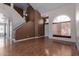 Bright and airy living room featuring hardwood floors, staircase, and large window at 3821 W Barcelona Dr, Chandler, AZ 85226