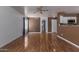 Open floor plan showcasing hardwood floors, neutral walls, and access to the kitchen area at 3821 W Barcelona Dr, Chandler, AZ 85226