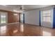 Spacious living room with hardwood floors, ceiling fan, and large windows for natural light at 3821 W Barcelona Dr, Chandler, AZ 85226