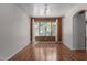 Open living room with hardwood flooring, large windows, and modern track lighting at 3821 W Barcelona Dr, Chandler, AZ 85226