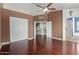 Primary bedroom featuring hardwood floors, archway, and bright closet at 3821 W Barcelona Dr, Chandler, AZ 85226