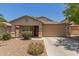 Charming single-story home with a well-maintained front yard and a two-car garage at 41280 W Sanders Way, Maricopa, AZ 85138