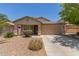 Charming single-story home with a well-manicured front yard and two-car garage at 41280 W Sanders Way, Maricopa, AZ 85138