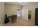 Carpeted bedroom featuring a ceiling fan, closet, mirror, and keyboard for music or work at 42812 W Venture Rd, Maricopa, AZ 85138