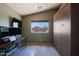 Guest bedroom featuring a full murphy bed and a window with a neighborhood view, offering flexibility and style at 42812 W Venture Rd, Maricopa, AZ 85138