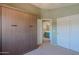Comfortable bedroom featuring a murphy bed and an ensuite bathroom offering a private space for relaxation and convenience at 42812 W Venture Rd, Maricopa, AZ 85138