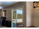 Dining area featuring sliding glass doors, rustic table and mountain views in the backyard at 42812 W Venture Rd, Maricopa, AZ 85138