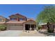 Charming two-story home with a well-manicured front yard and attached two-car garage at 42812 W Venture Rd, Maricopa, AZ 85138